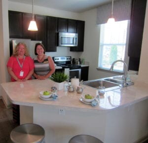 Stephanie Boatwright and C.R. Hall, principal of Busbee Middle School, came over to check out the new Otarre Pointe complex. Otarre Pointe held a ribbon cutting Wednesday. 