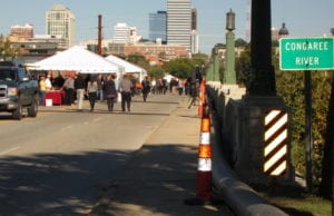 Crowds make their way to rare chance to dine on the Gervais Street Bridge. 